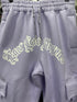 FB County Fleece Cargo Pants in lavender with "East Los Angeles" graphic in white on the front. Features cargo pockets.