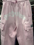 Pro Club Fleece Cargo Pants in pink featuring "East Los Angeles" graphic and cargo pockets for style and functionality.