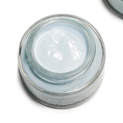 Blue Beauty Cream Soothing Tallow Face Cream in a clear jar, featuring a smooth, light blue cream inside.