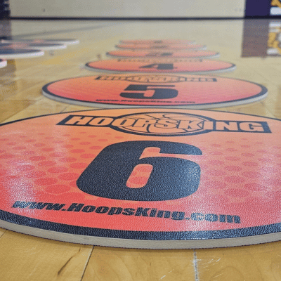 Offensive Spacing Training Spot Markers, 16", featuring bright orange design with numbers on a gym floor.